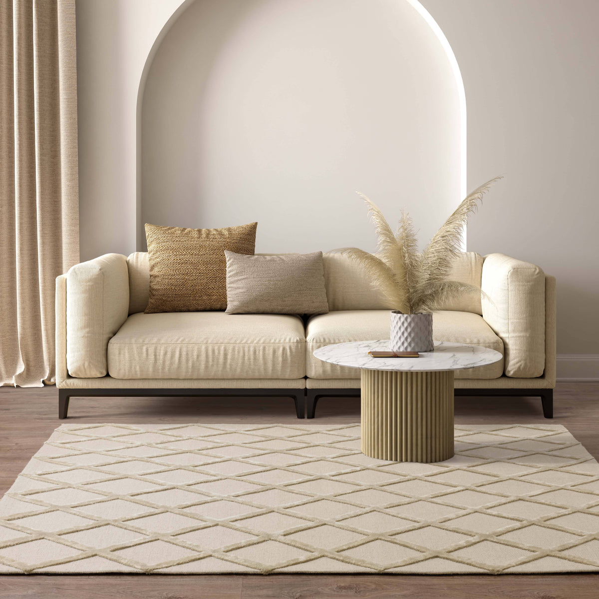 A cream wool rug under a linen sofa