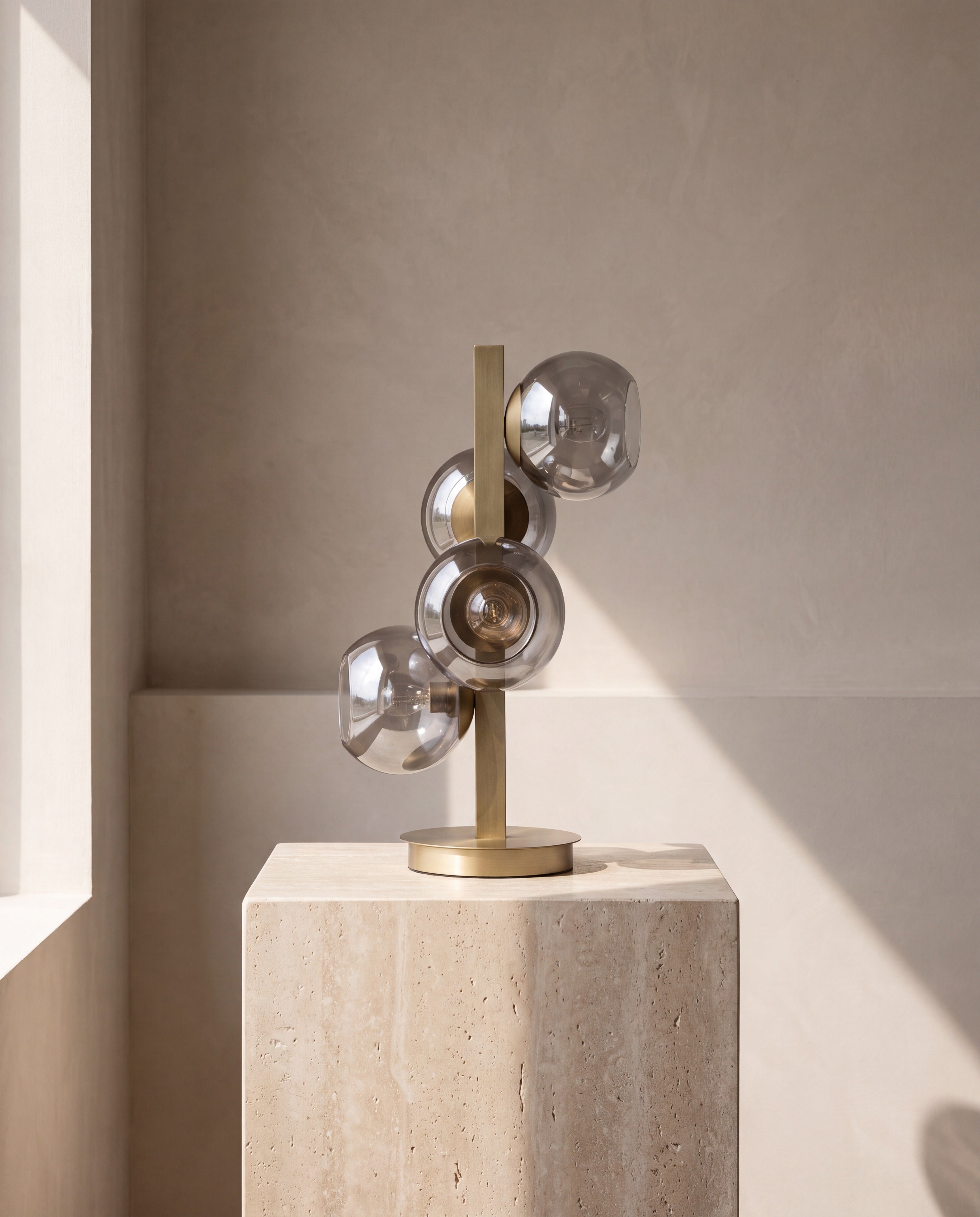 Brass Four-Light Table Lamp with Silver Globe Shades — on limewash plaster