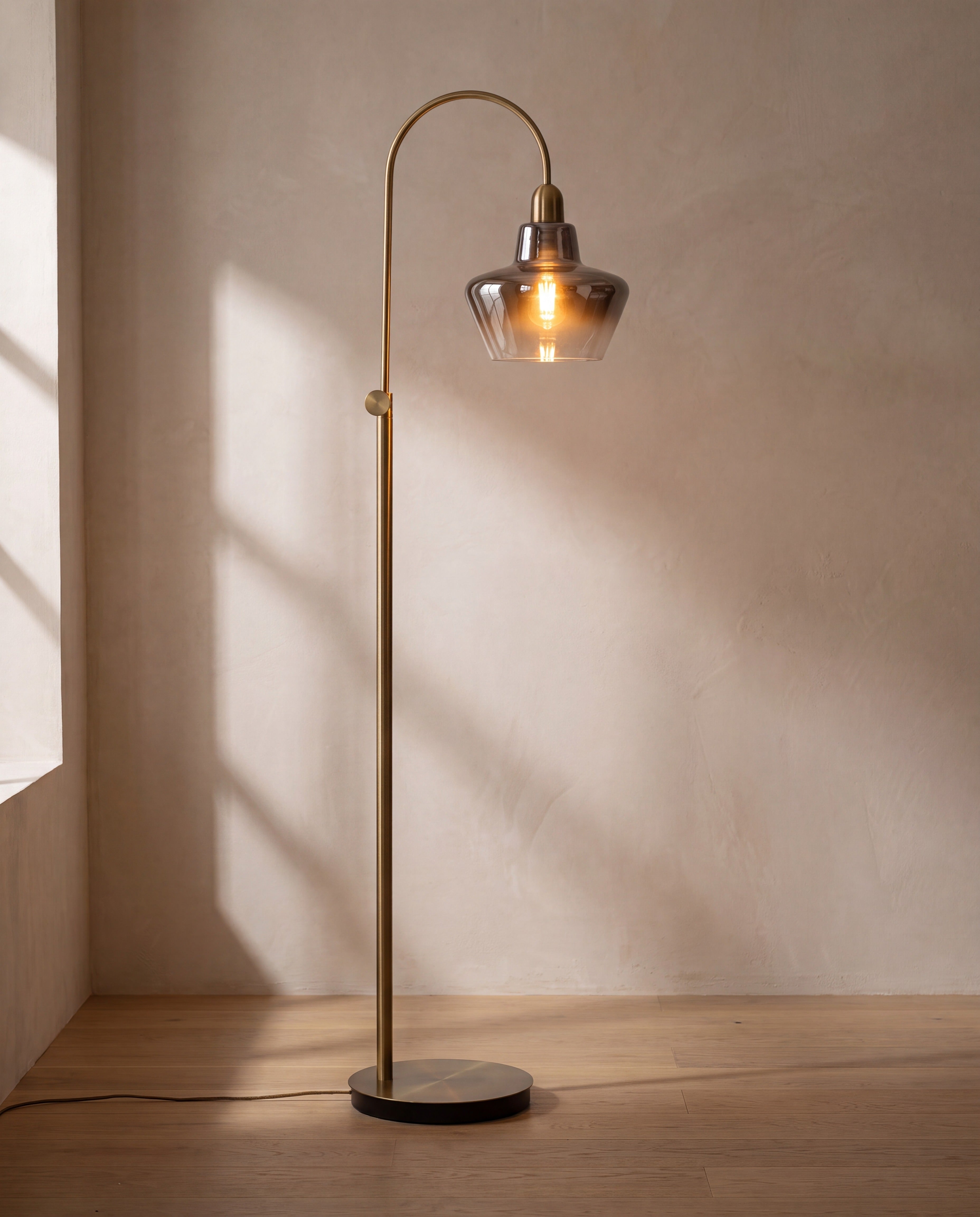 Adjustable Arc Floor Lamp — illuminated, warm glow