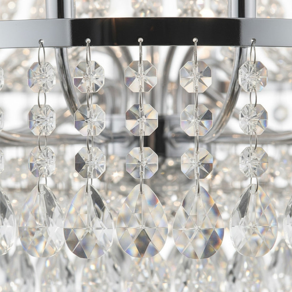 Close-up detail of crystal prisms and chrome frame joints on Tiered Crystal Empire Chandelier