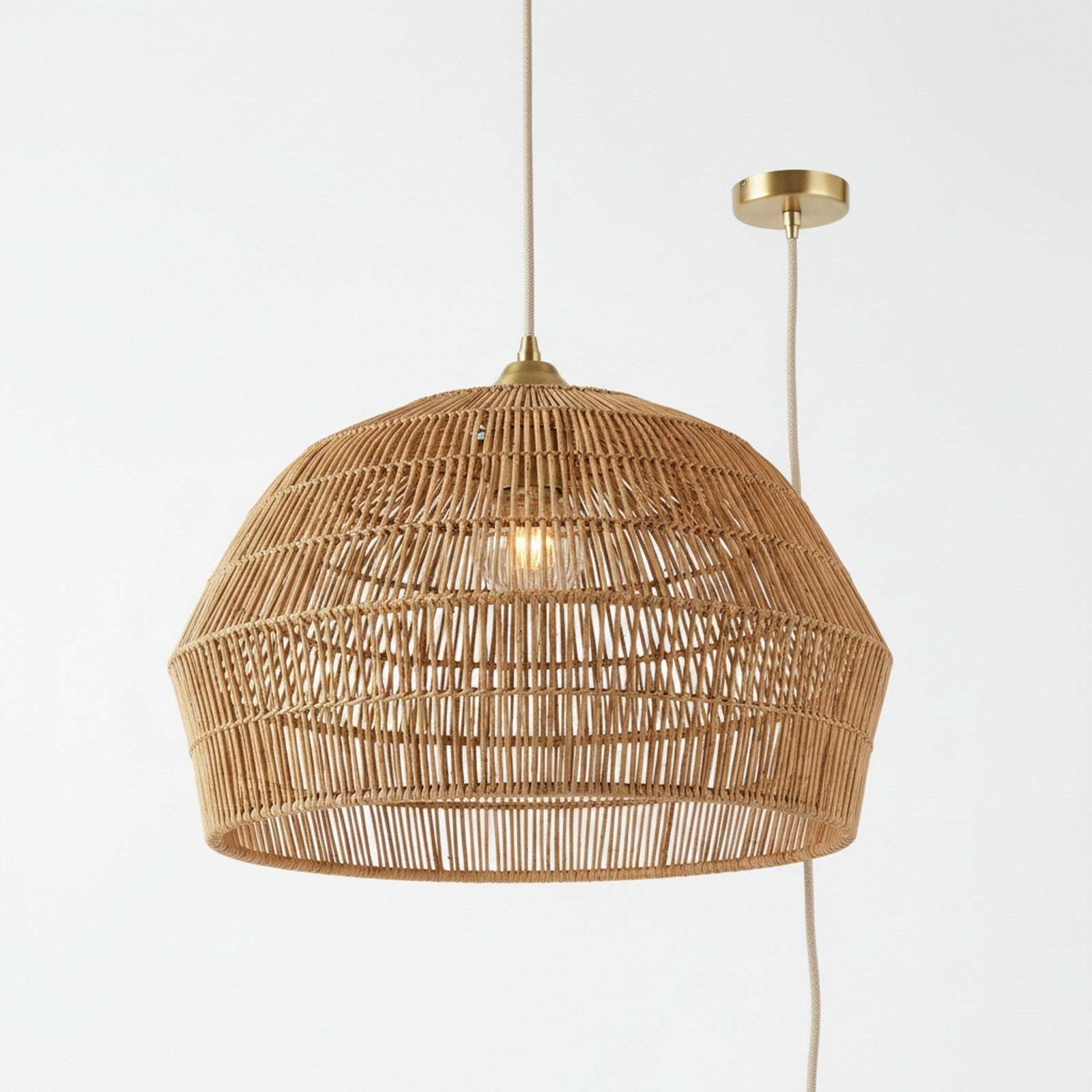 Rattan Woven Dome Pendant - view from below showing light filtering through woven rattan