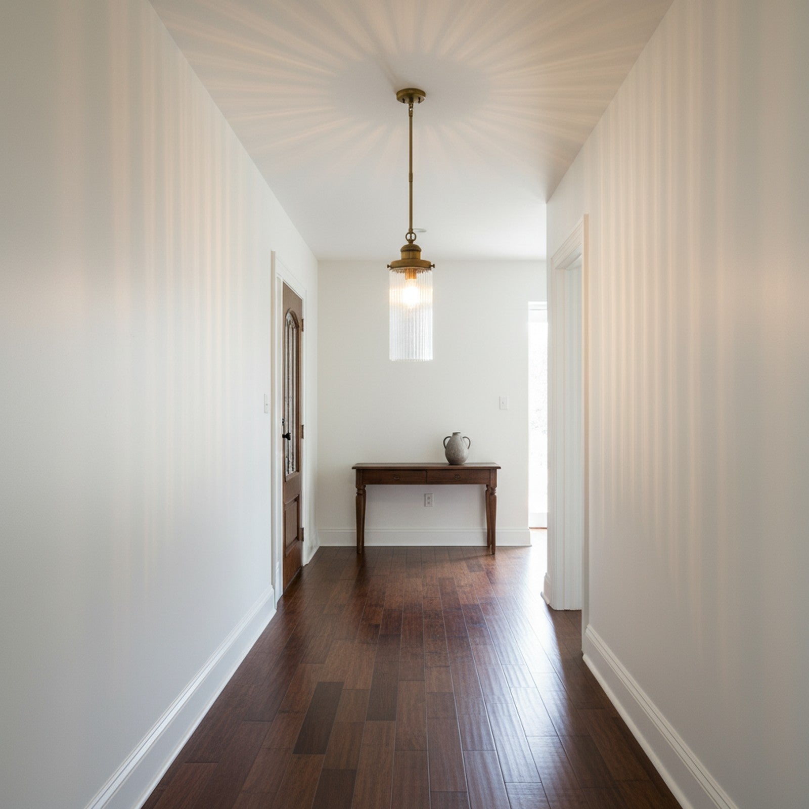 Ribbed Glass Cylinder Pendant - in hallway entryway creating light patterns on walls