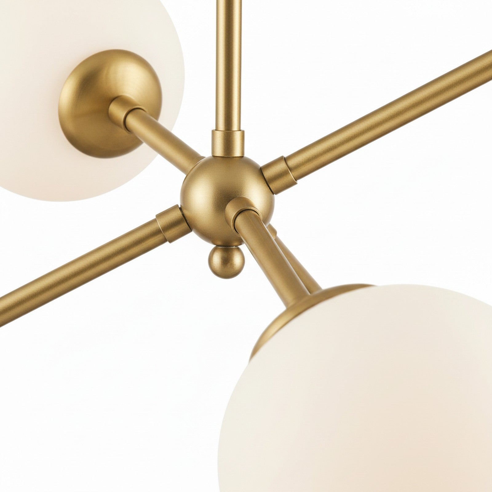 Asymmetric 3-Arm Pendant - close-up of central brass junction and arm joinery
