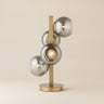 24" Brass Metal Four Light Novelty Table Lamp With Silver Metallic Globe Shades