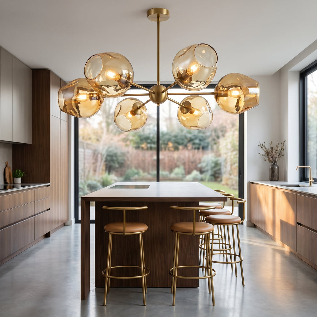 Sculptural Blown Glass Chandelier above modern kitchen island with brass bar stools