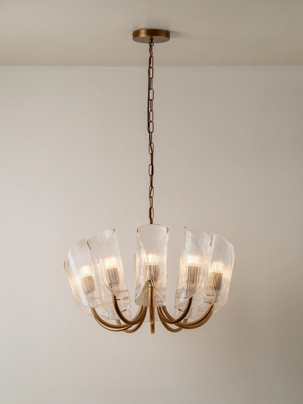 Carnival - 10 Lightweight Chandeliers in Aged Brass and Textured Glass