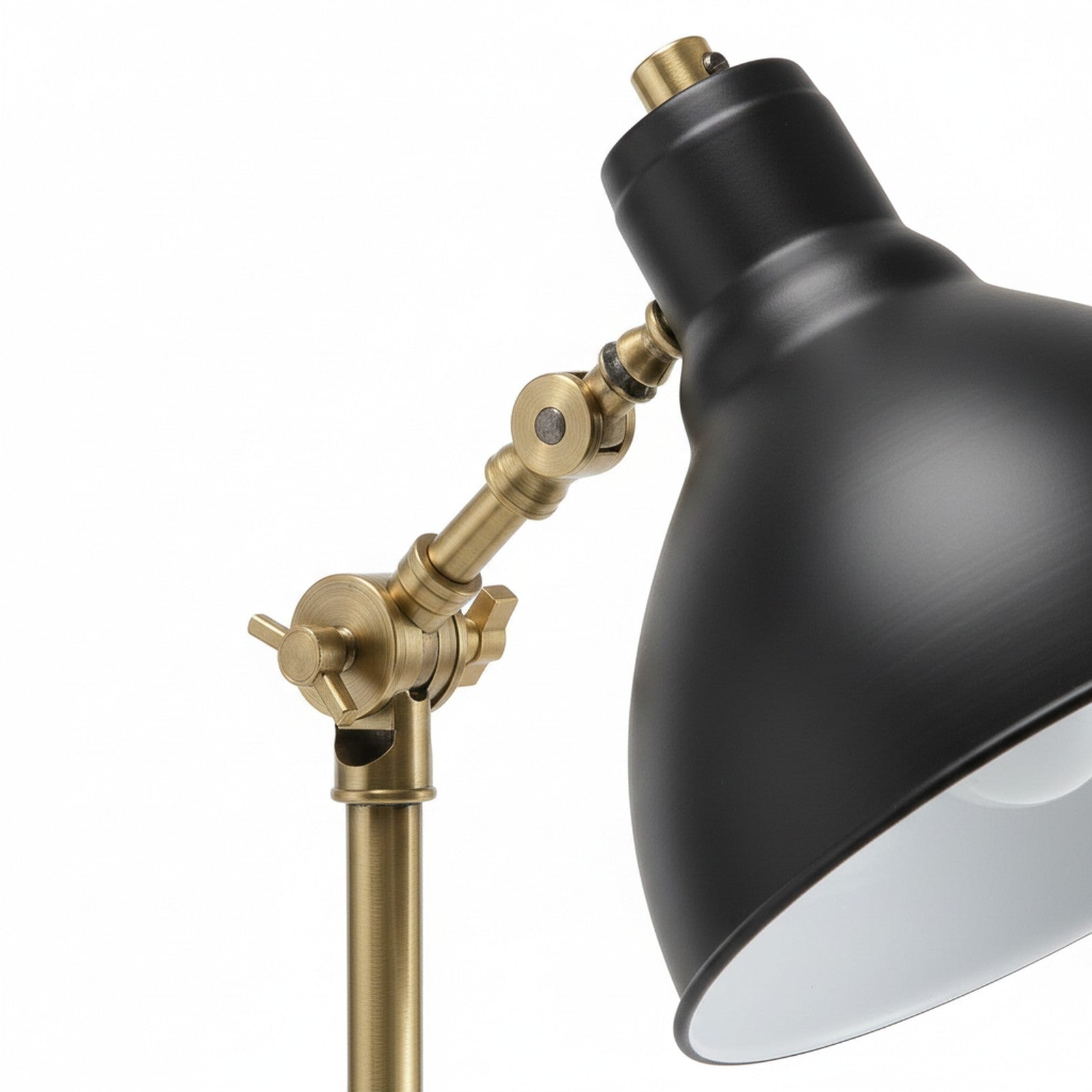 Close-up of arched lamp adjustable joint mechanism and black dome shade detail