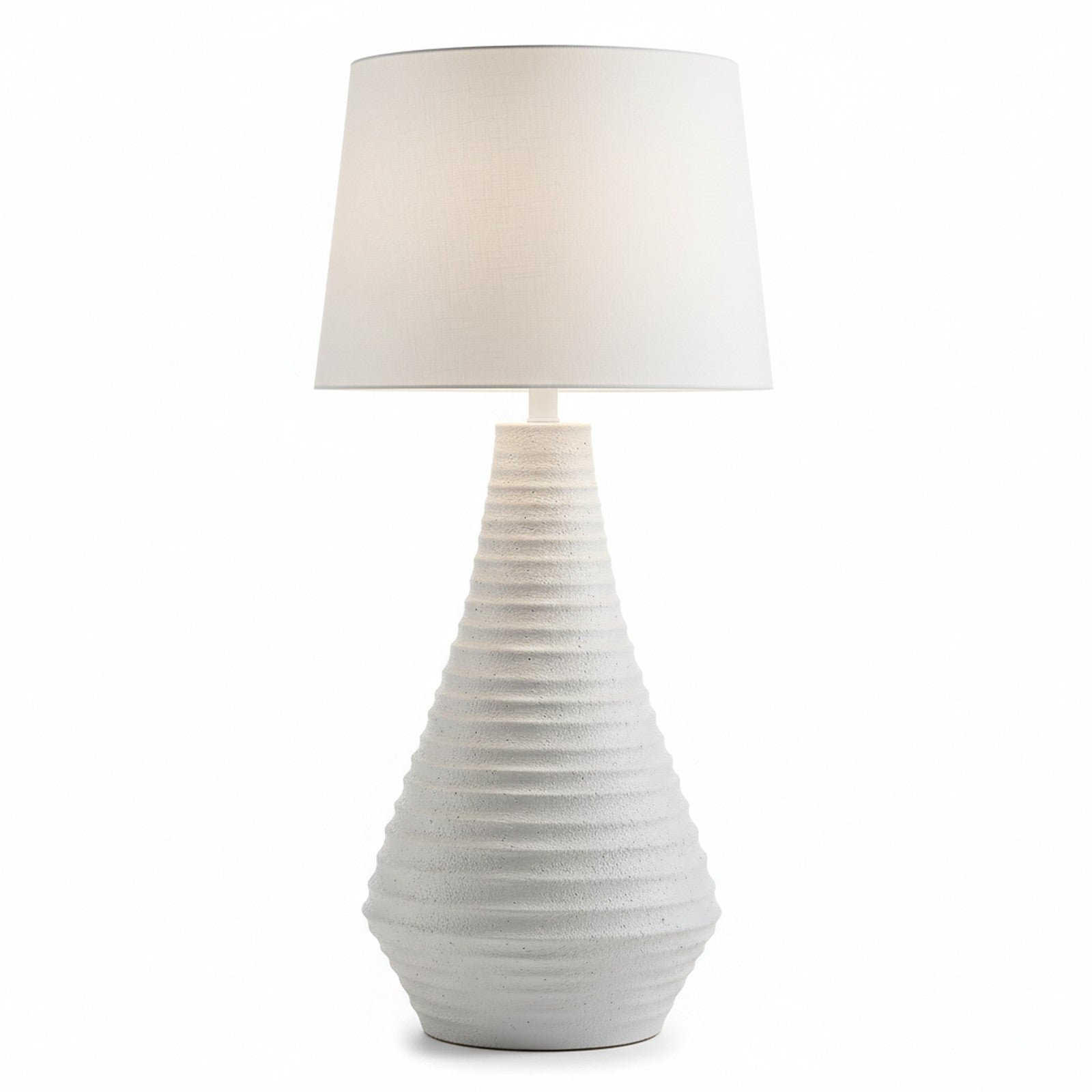 White ceramic textured table lamp side profile showing full height and tapered proportions