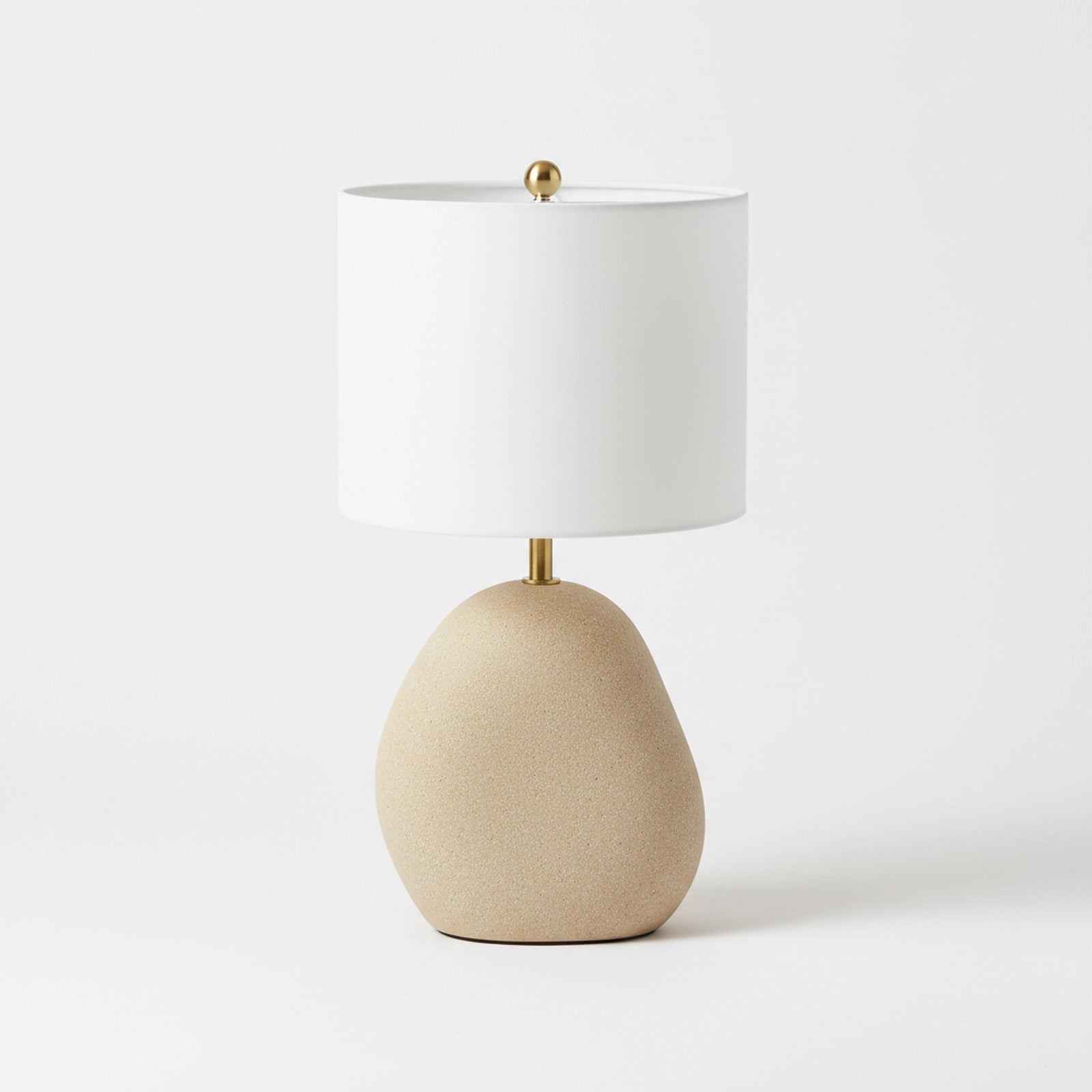 Cast stone sculptural table lamp top-down view showing organic non-cylindrical base shape