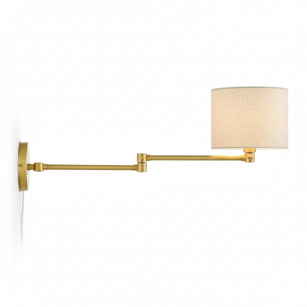 Brass swing-arm wall sconce fully extended showing maximum reach and articulation range