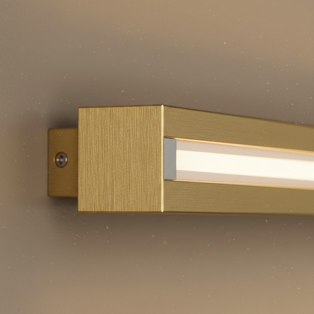 Close-up of brushed brass LED bar end showing slim profile and integrated LED strip quality